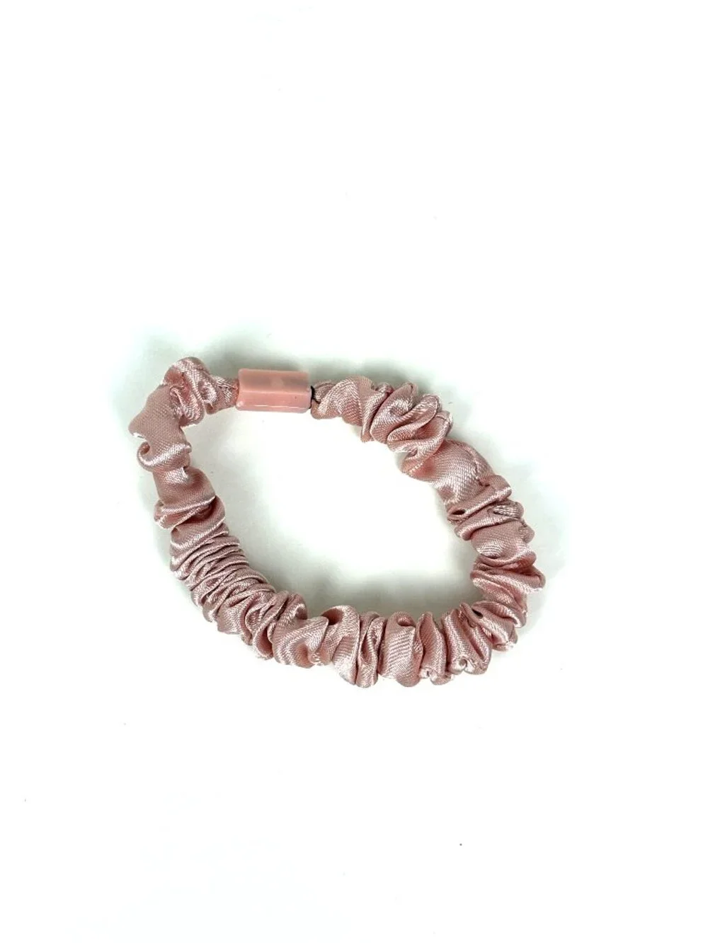 Skinny satin hair scrunchie / skinny hair tie in a light pink / blush shade. New